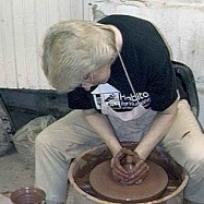A photo of Debra Ocepek at the potter's wheel